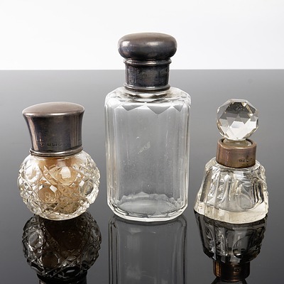 Three antique Crystal and Cut Glass Perfume Bottles with English Hallmarked Silver Mounts including Hardy Bros
