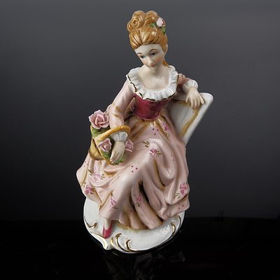 Meissen Seated Lady with Basket Porcelain Figurine
