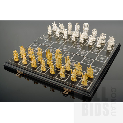 Chinese Export Carved and Stained Ivory Chess Set in a Black Lacquer and Pearl Shell Decorated Box, Circa 1950