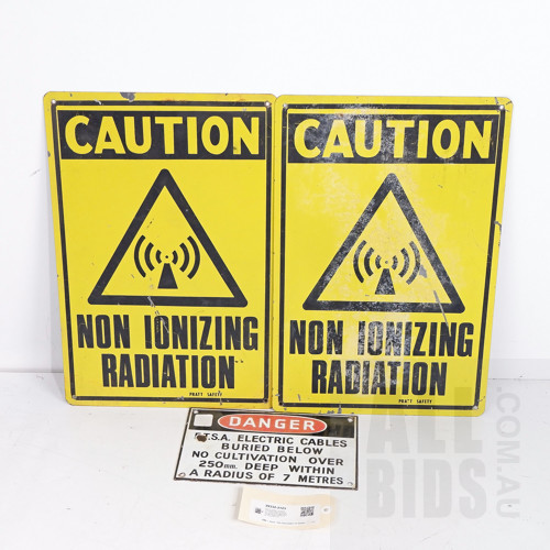 Pair of Painted Tin Radiation Caution Signs 46 by 30cm, and an Enamelled Steel Danger Electric Cables Sign 15 by 24cm (3)