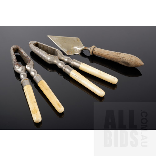 Pair of Antique Ivory Handled Nickel Plated Nutcrackers, and an EPNS Slicing Trowel