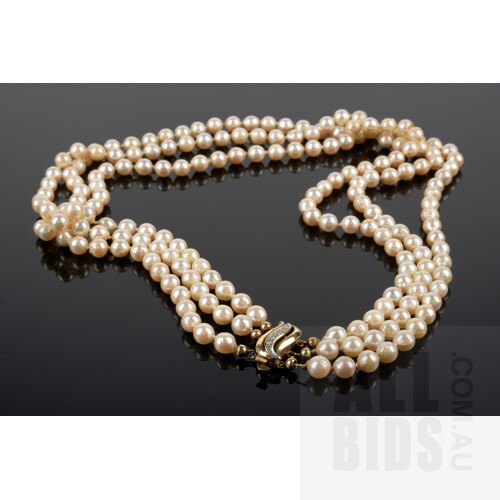 Triple Strand of Semi Baroque Akoya Type Cultured Pearls, 14ct Yellow Gold Clasp with Single Cut Diamonds