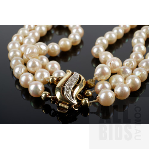 Triple Strand of Semi Baroque Akoya Type Cultured Pearls, 14ct Yellow Gold Clasp with Single Cut Diamonds