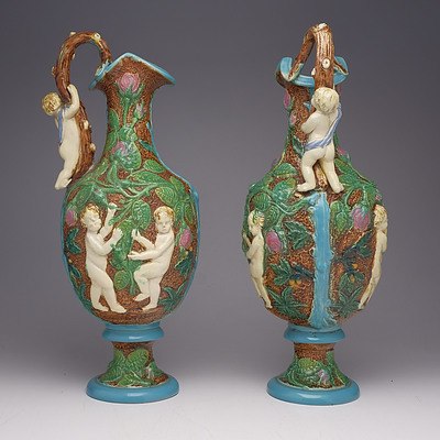 Fine Pair of Large Victorian Majolica Ewers Moulded with Putti, England Circa 1880, Probably William Brownfield