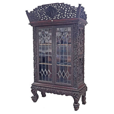Impressive Antique Chinese Export Hardwood Display Cabinet Profusely Carved with Dragons and Bats in Clouds, Circa 1900