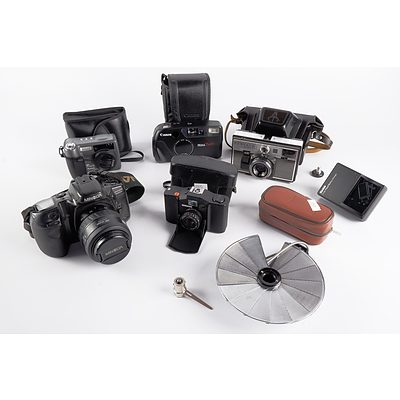 A Group of Cameras including Canon and Minolta and a Canon Flash