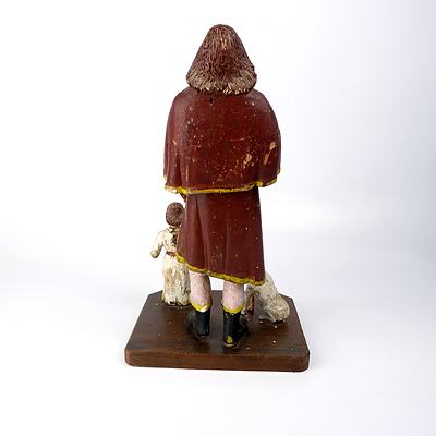Antique Filipino Hand Carved and Painted Santos Figure of Saint Roch Wearing Pilgrimage Garb and Pointing to a Lesion on his Thigh, Late 19th to Early 20th Century
