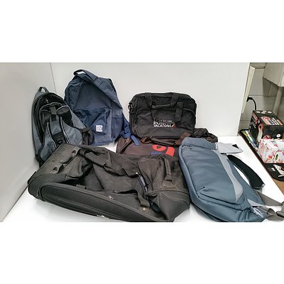 Assorted Backpacks And Qantas Suitcase