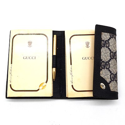 Gucci Pocket Notebook and a Michael Kors Wallet with Care Card