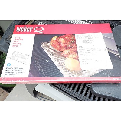 A Weber Q Gas Barbeque With New Boxed Roasting Trivet