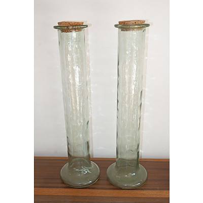 A Pair of Tall Glass Vases with Cork Stoppers