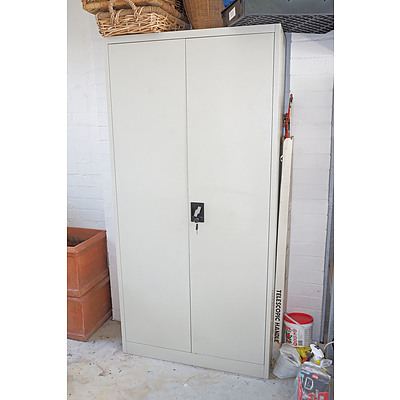 A Metal Storage Cupboard with Four Adjustable Shelves