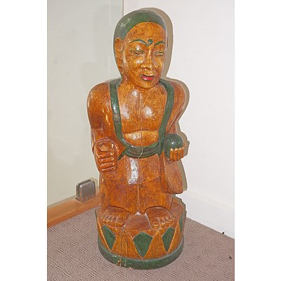 A Carved and Polychrome Painted Balinese Figure/Umbrella Holder