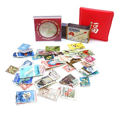 Cased Republic of Singapore Anniversary Coin and a Matchbox of Vintage Stamps