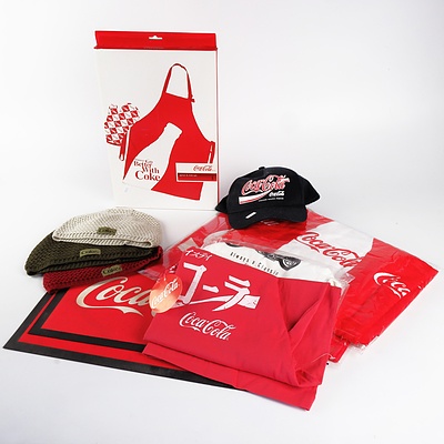 Group of New Coca Cola T Shirts, Caps, Apron & Mitt Set, Bag, Towel and Two Used Bar Mats