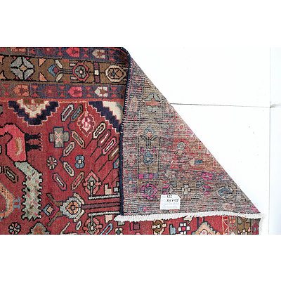 Persian Nahavad Hand Knotted Wool Pile Rug with Diamond Central Medallion and Floral and Bird Design on a Red Ground