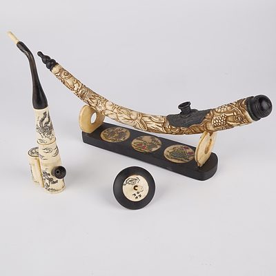 Two Chinese Carved Bone Opium Pipes and a Spinning Top
