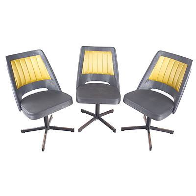 Three Retro Metal Based Swivel Chairs with Two Tone Vinyl Upholstery