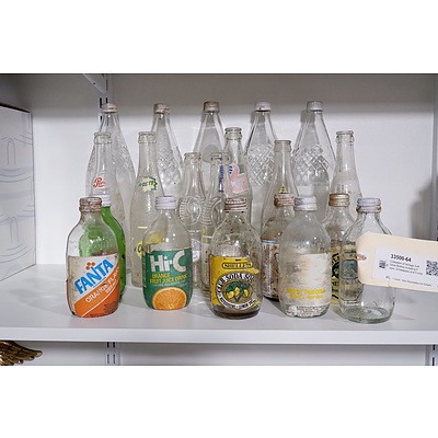 Collection of Vintage Soft Drink Bottles including Pepsi, Schweppes and Frosty