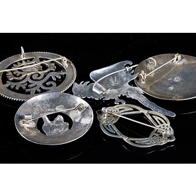 Four Various Mexican and South American Sterling Silver Brooches and a Celtic Brooch