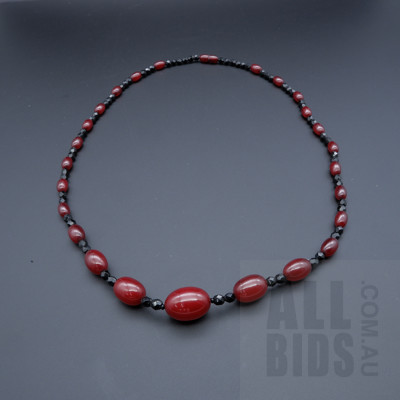Strand of Cherry Bakelite Beads Alternating with Black Glass