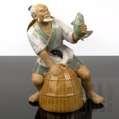 Chinese Shiwan Pottery Figure of a Fisherman
