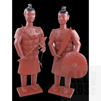 Two Burgundy Painted Metal Tibetan Warrior Figures
