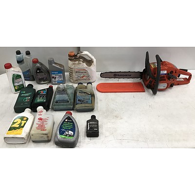 Husqvarna E Series Chainsaw with Assorted Oils and Lubricants