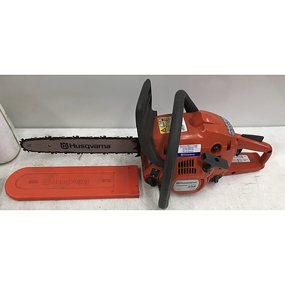 Husqvarna E Series Chainsaw with Assorted Oils and Lubricants