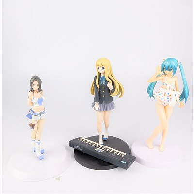 Three Anime Figurines on Stands by Sega and Banpresto