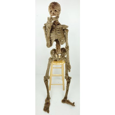 Faux Fur Covered Artificial Skeleton on Stool