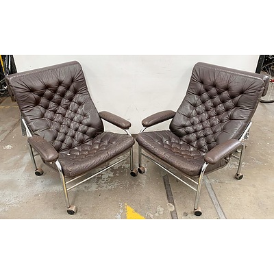 Pair of Leather Arm Chairs on Caster Wheels