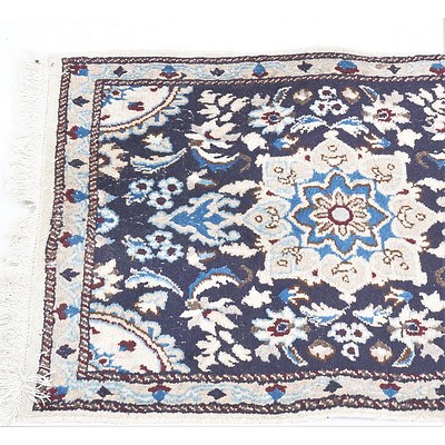 Small Persian Hand Knotted Wool Pile Rug with Floral Motifs on a Dark Blue Ground