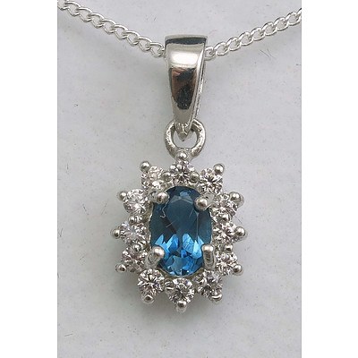 Sterling Silver Pendant Set With London Blue Topaz In Cz Halo