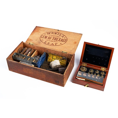 Two Antique Sets of Weights and a Fishing Lure in a Wooden Cigar Box