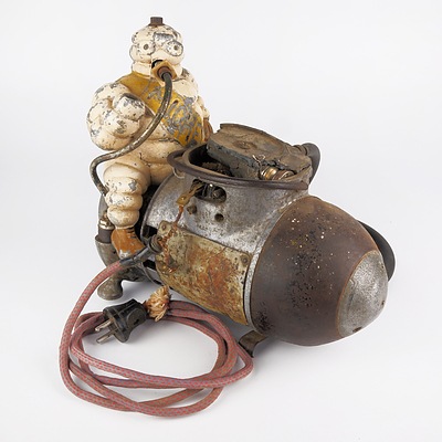 Original Cast Metal Michelin Man Mounted on a Portable Air Compressor