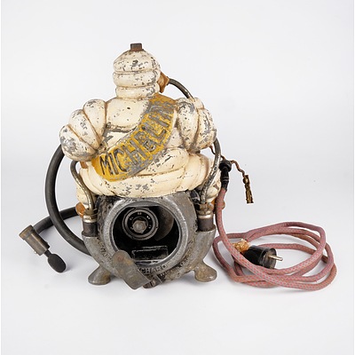 Original Cast Metal Michelin Man Mounted on a Portable Air Compressor