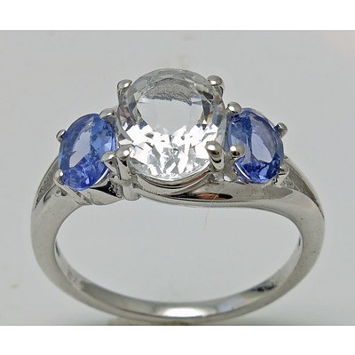 Sterling Silver Ring Set With Light Blue Aquamarine With Tanzanite Shoulders