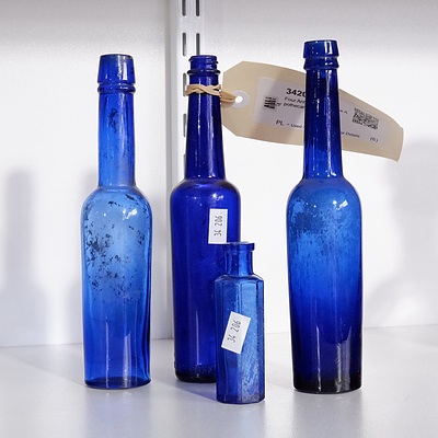 Four Antique Cobalt Blue Apothecary Bottles