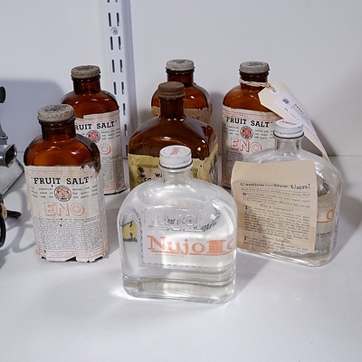 Seven Vintage Medicinal Bottles with Contents including Eno fruit Salt and Nujol
