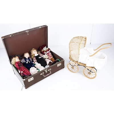Vintage Suitcase, Group of Porcelain Dolls, and Cane Doll's Pram