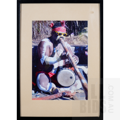 A Framed Photographic Print of a Didgeridoo Player