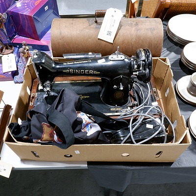 Vintage Electric Sewing Machine with a Collection of Accessories