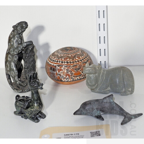 Three African Carved Stone Animals, a Carved Peruvian Folk Art Gourd, and a Brass Dolphin
