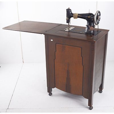 Vintage New Home Treadle Sewing Machine in Oak and Walnut Cabinet