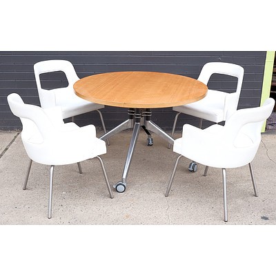 Four Norman and Quaine White Leather Upholstered Chairs and a Circular Timber Veneer Dining Table on Wheels