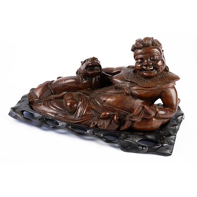 Large Antique Chinese Hardwood Carving of a Reclining Sage, Late 19th to Early 20th Century