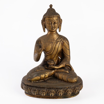 Cast Bronze Figure of Buddha Shakyamuni with Alms Bowl and Third Eye Seated on a Lotus Base