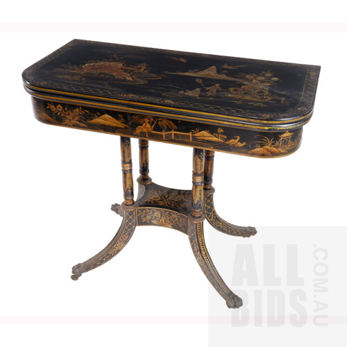 Late Georgian Chinoiserie Black and Gilt Lacquered Fold-over Games Table the Sabre Legs Terminating with Brass Paw Sabots and Castors, 19th Century