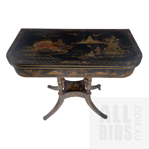Late Georgian Chinoiserie Black and Gilt Lacquered Fold-over Games Table the Sabre Legs Terminating with Brass Paw Sabots and Castors, 19th Century